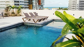 Outdoor pool, pool umbrellas, sun loungers