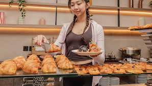 A buffet area with a variety of pastries and a buffet station. - Oria Hotel Jakarta (Jakarta)