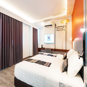 Habitación Deluxe con 2 camas individuales | Caja fuerte, escritorio, wifi gratis y ropa de cama