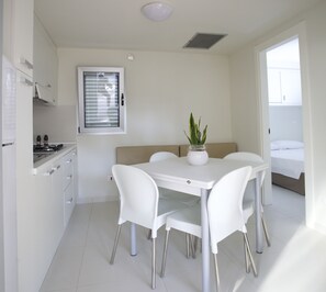 Family Suite | Private kitchen | Full-size fridge, stovetop, cookware/dishes/utensils - Sira Resort (Nova Siri)