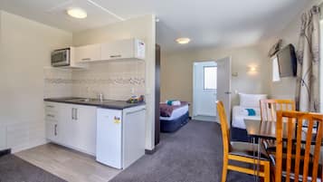 Studio, Bay View | Living area | Flat-screen TV