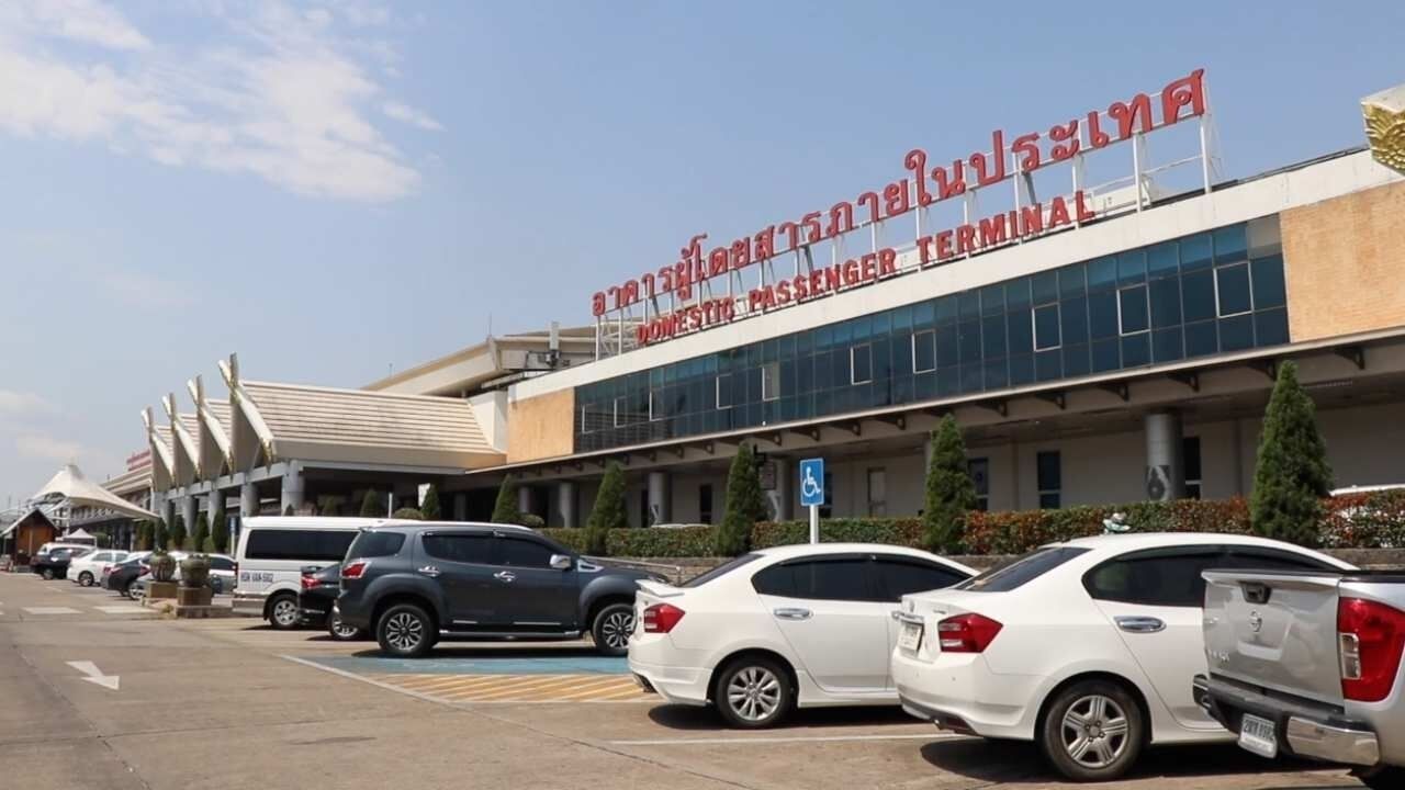 A building with a sign reading "Domestic Passenger Terminal" in a foreign script.