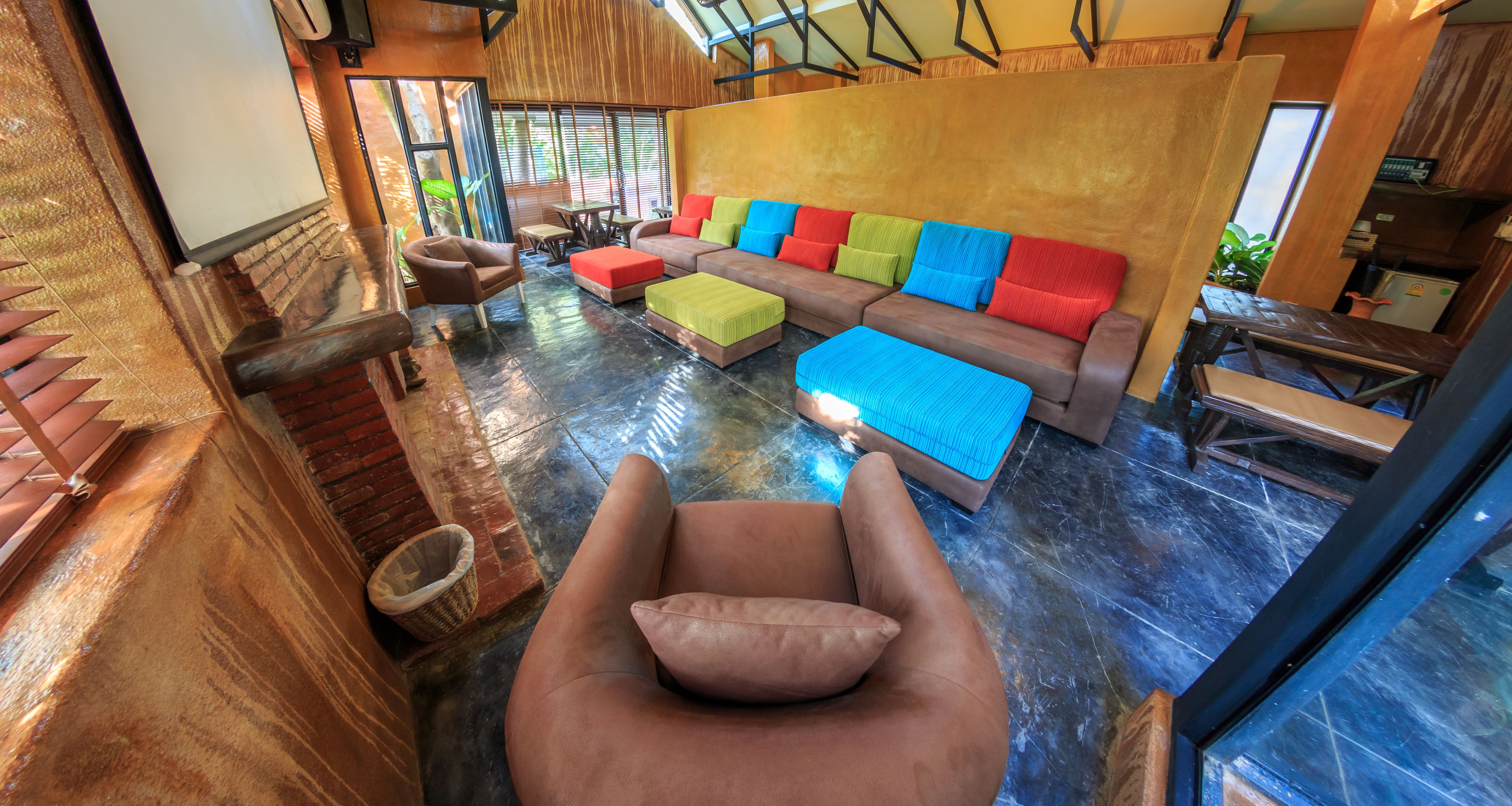 A modern living room with a sofa set, a coffee table, and a cushioned chair.