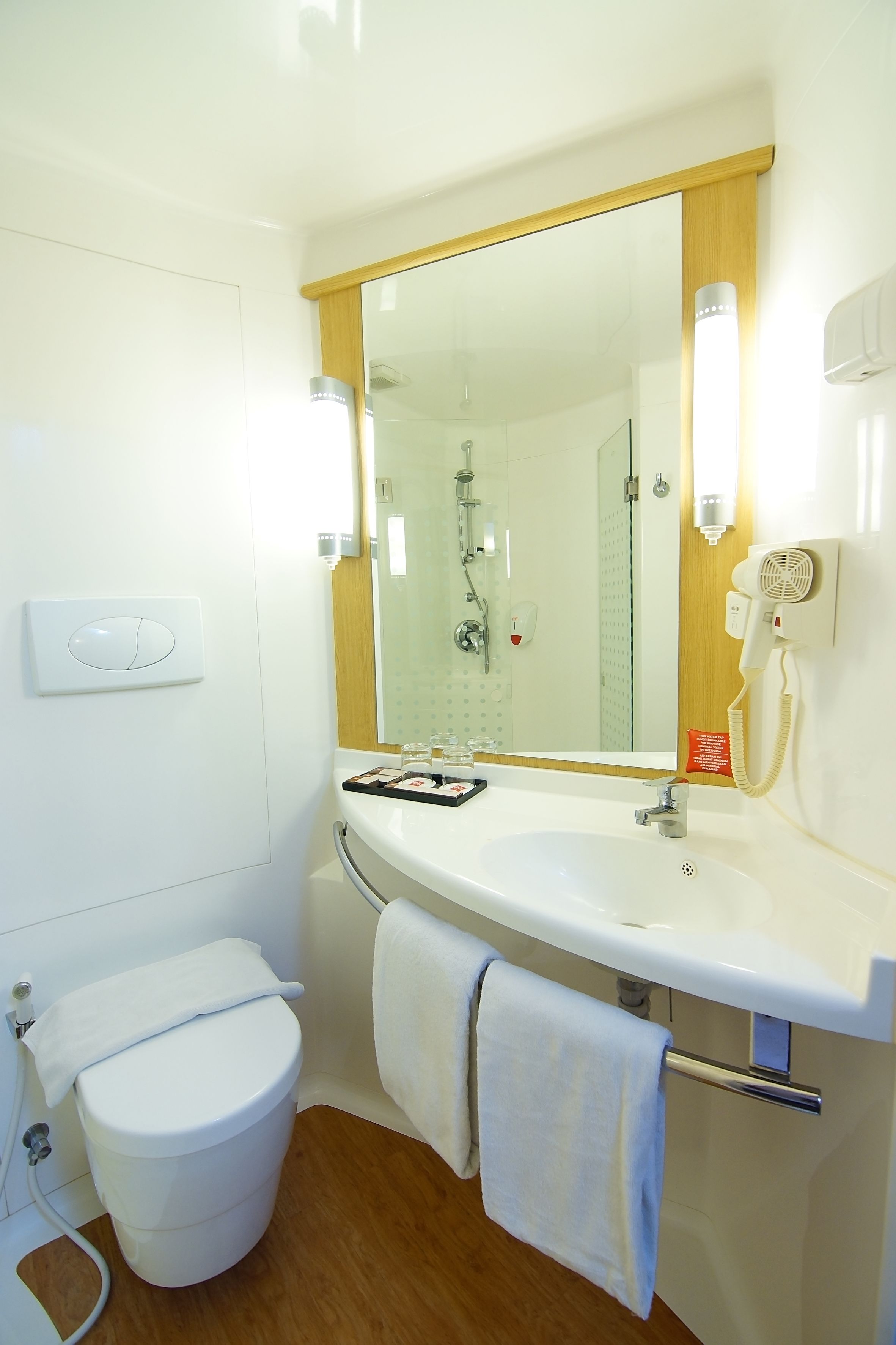 shower, eco-friendly toiletries, hair dryer, slippers