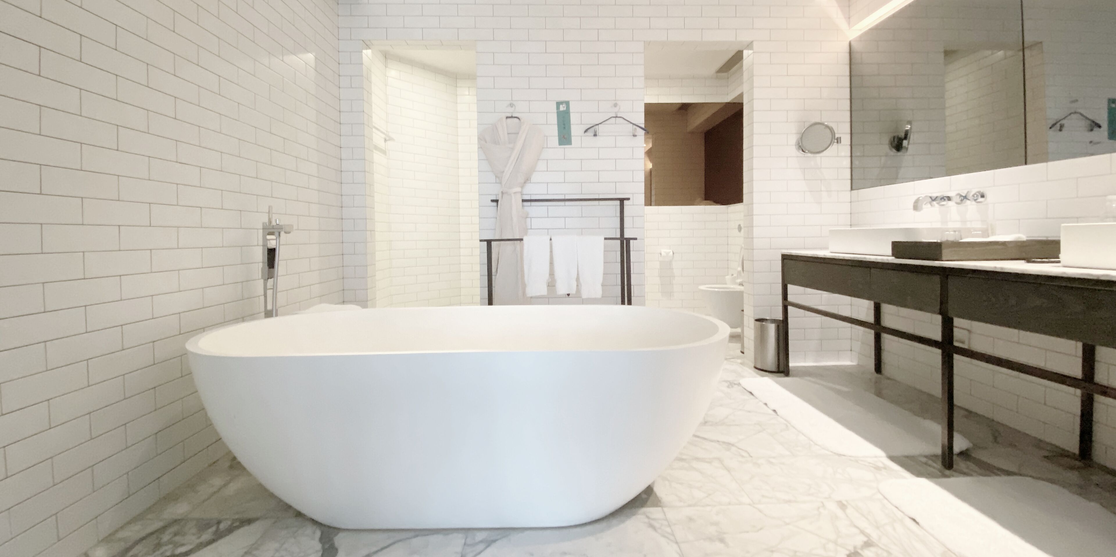 suite, 1 king bed, city view | bathroom | separate bathtub and shower, hair dryer, towels