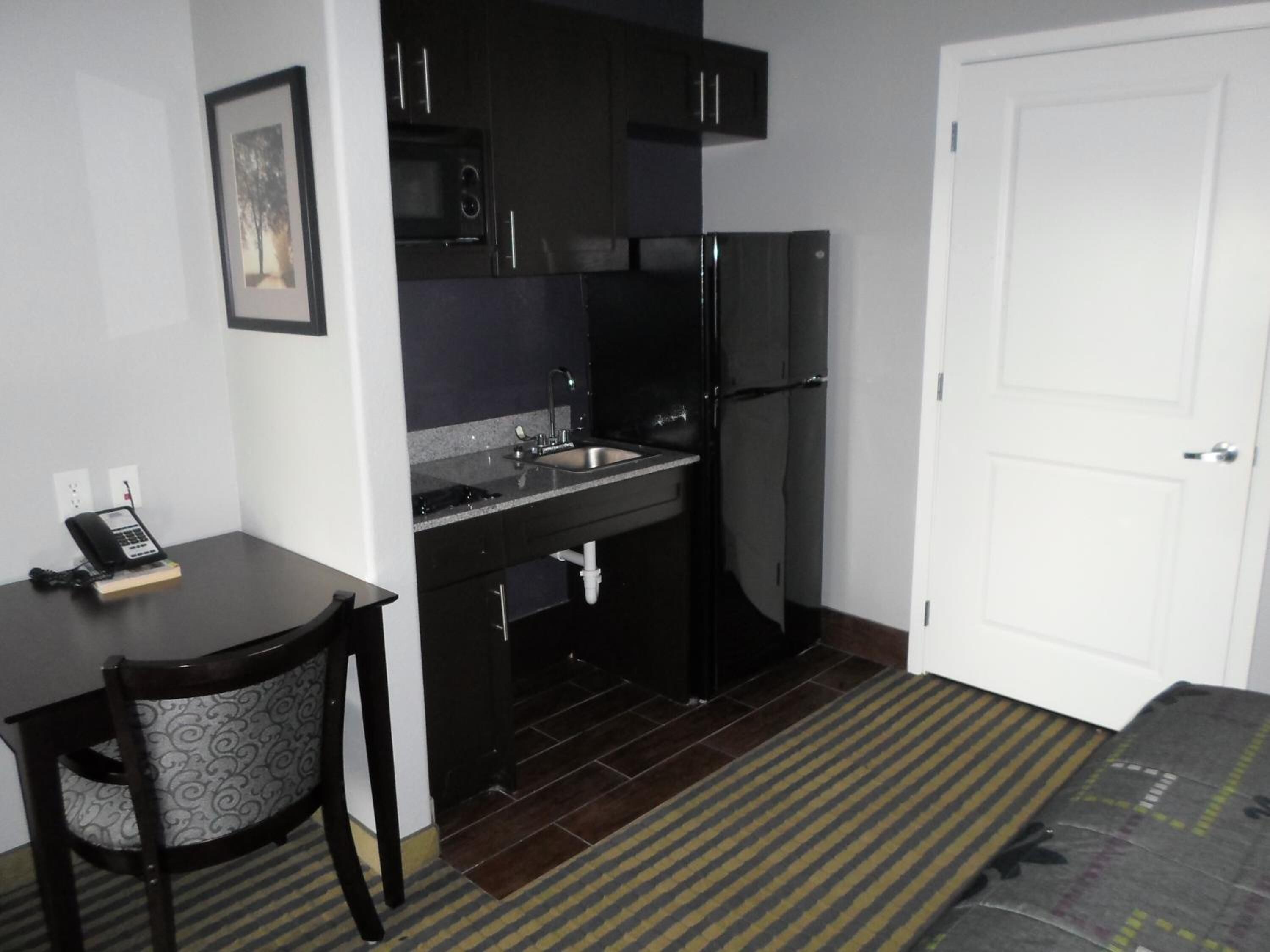 Fridge, microwave, coffee/tea maker, dining tables