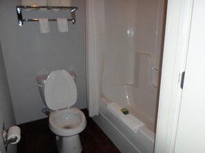 Combined shower/bathtub, towels, toilet paper