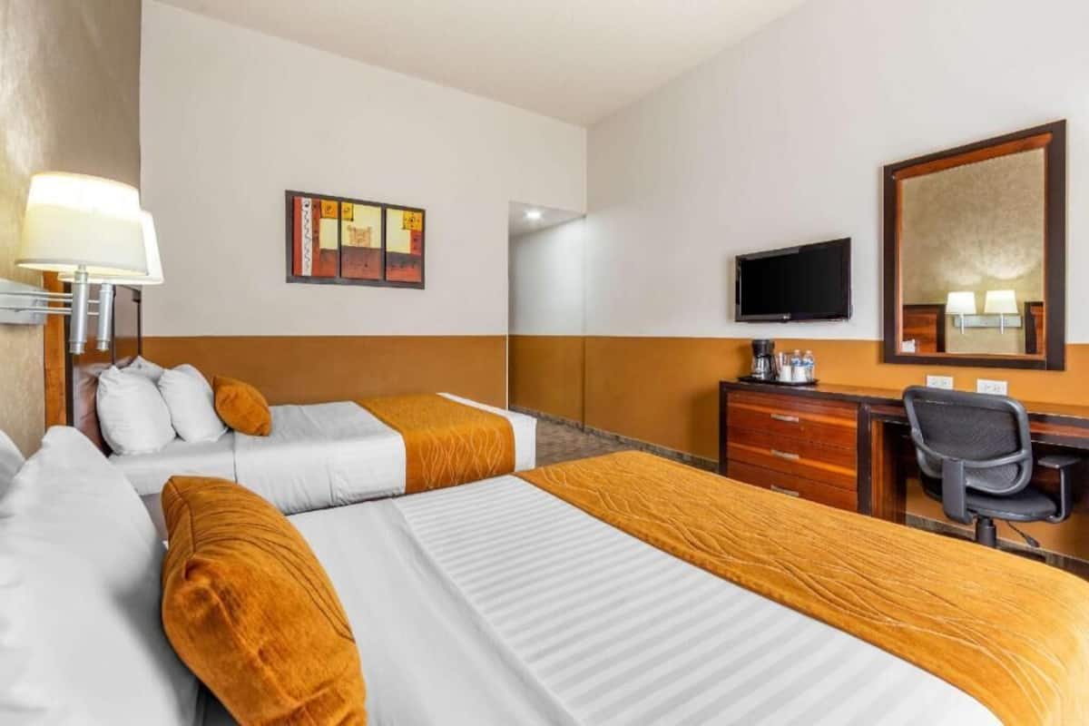 Desk, iron/ironing board, bed sheets
