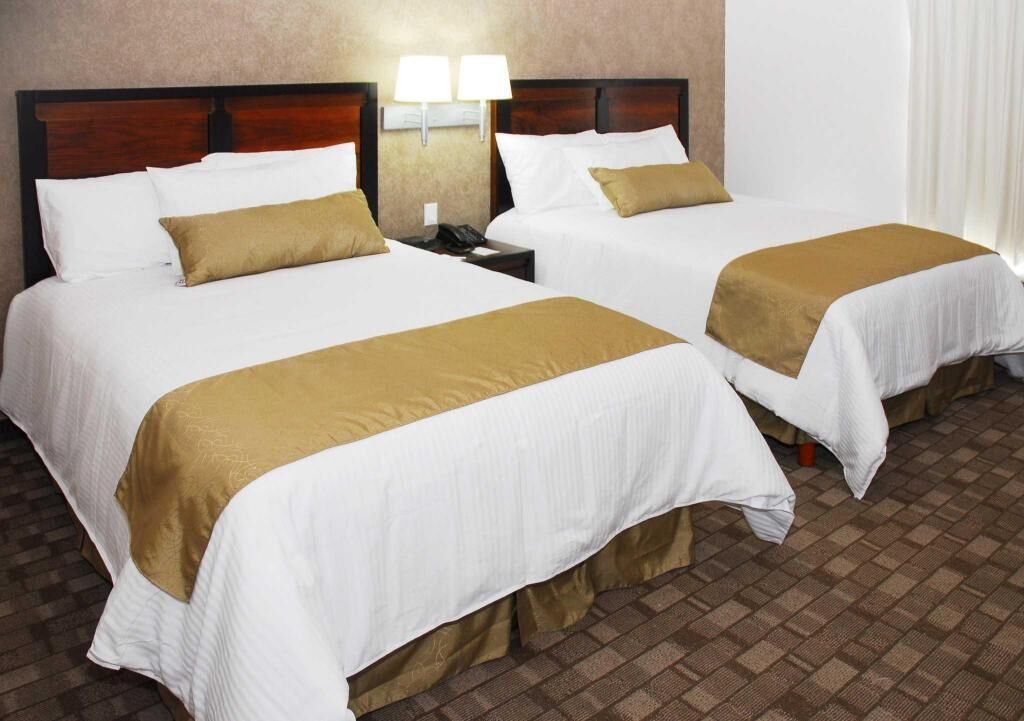 Desk, iron/ironing board, bed sheets