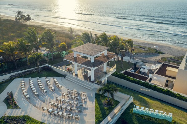 An aerial view of a resort with a beachside patio, outdoor seating, and a pool area. - Iberostar Selection Playa Mita - All Inclusive (Punta de Mita)