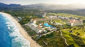 A resort with multiple buildings, a large swimming pool, and a beach. - Iberostar Selection Playa Mita - All Inclusive (Punta de Mita)