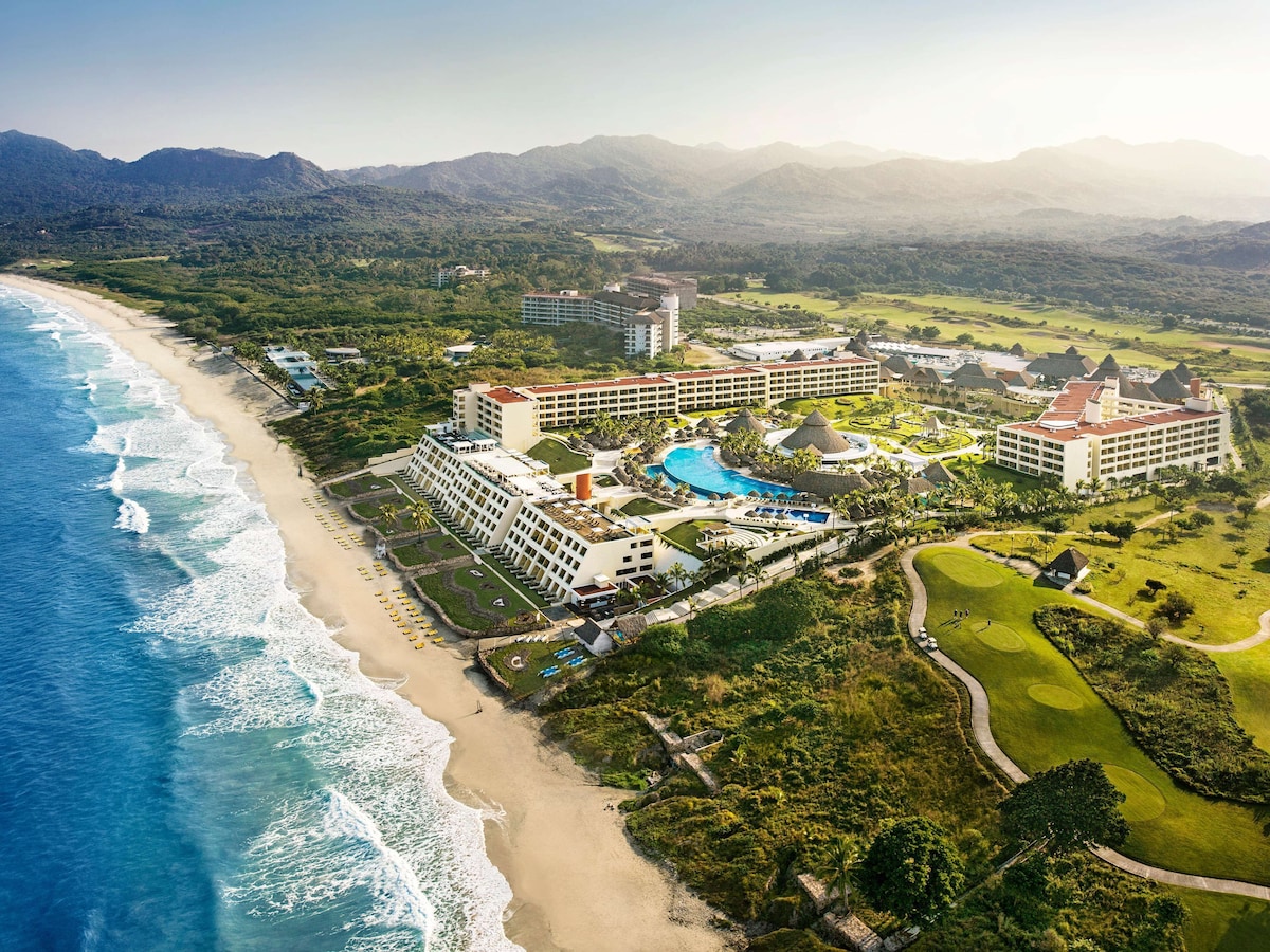 A resort with multiple buildings, a large swimming pool, and a beach. - Iberostar Selection Playa Mita - All Inclusive (Punta de Mita)