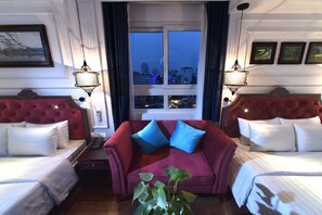 Premium Quadruple Room, City View | Living area | 32-inch LCD TV with satellite channels, TV - Hanoi Avatar Hotel (Hanoi)