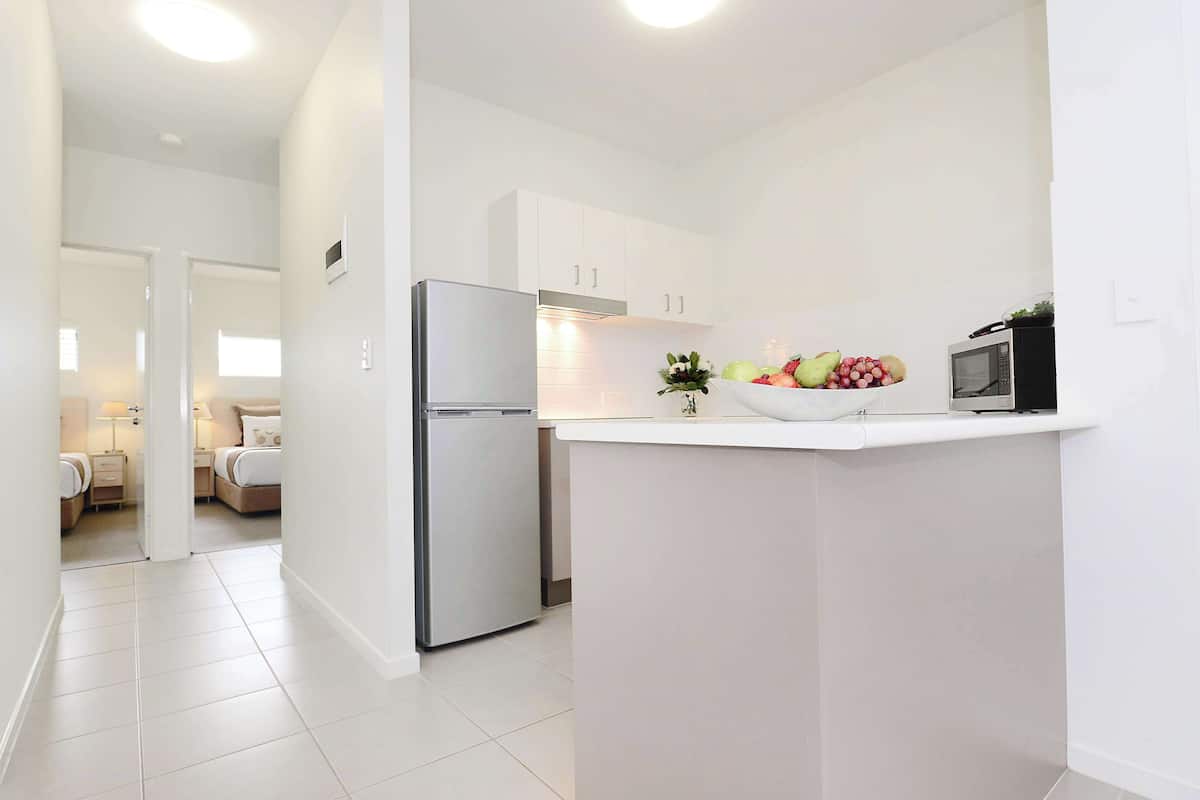 full-sized fridge, microwave, stovetop, dishwasher
