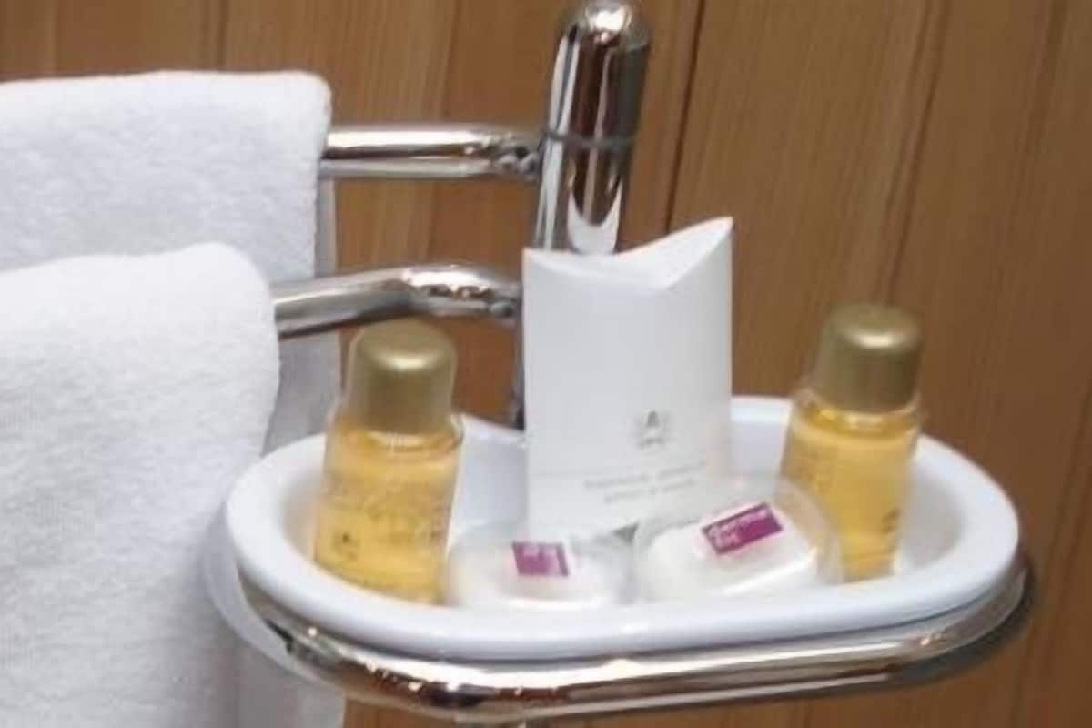 bathtub, hair dryer, bathrobes, towels