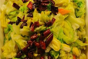 A close-up of a dish with shredded vegetables and red chili peppers. - Sihai Grand Hotel (Anshan)