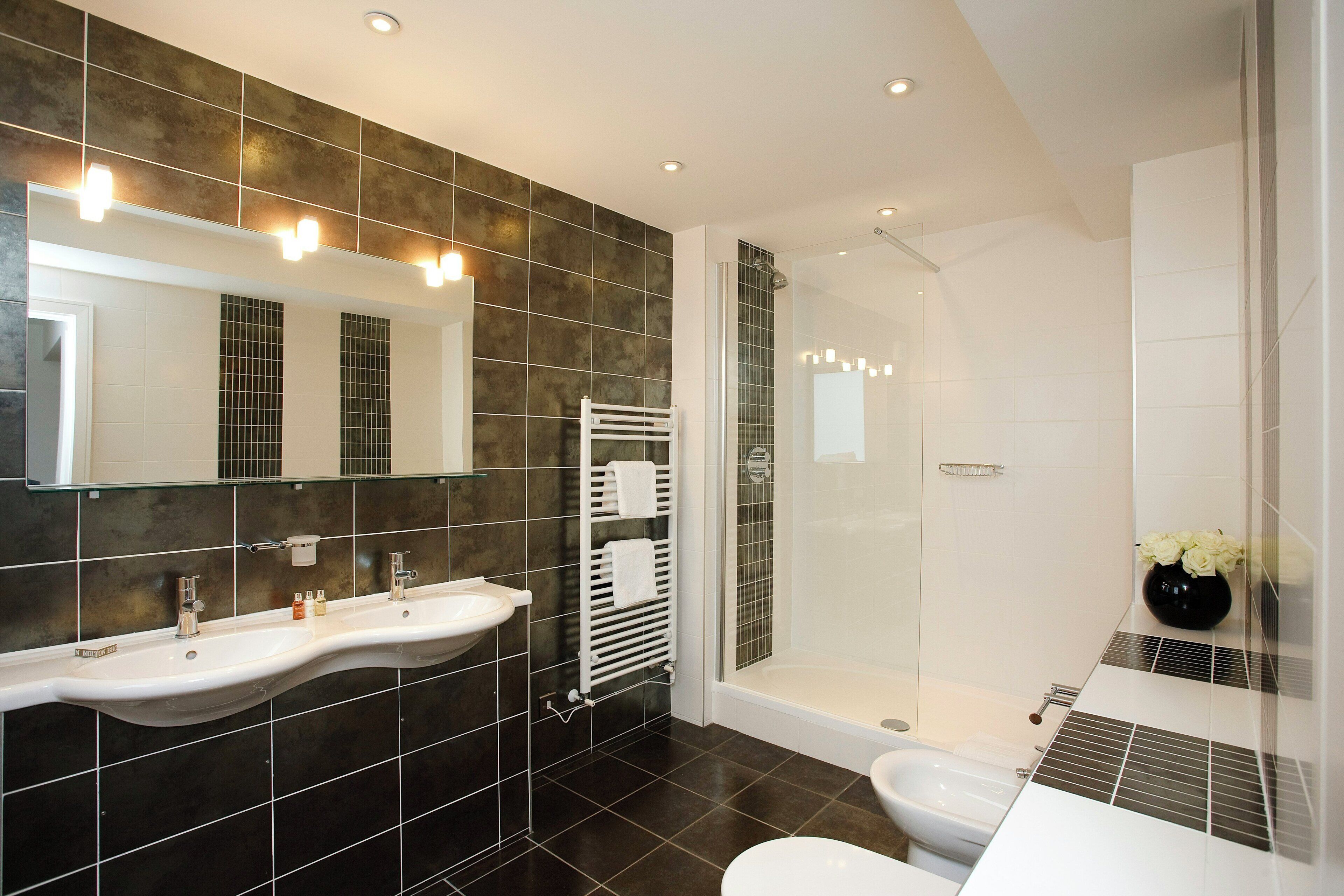 Designer toiletries, hair dryer, towels