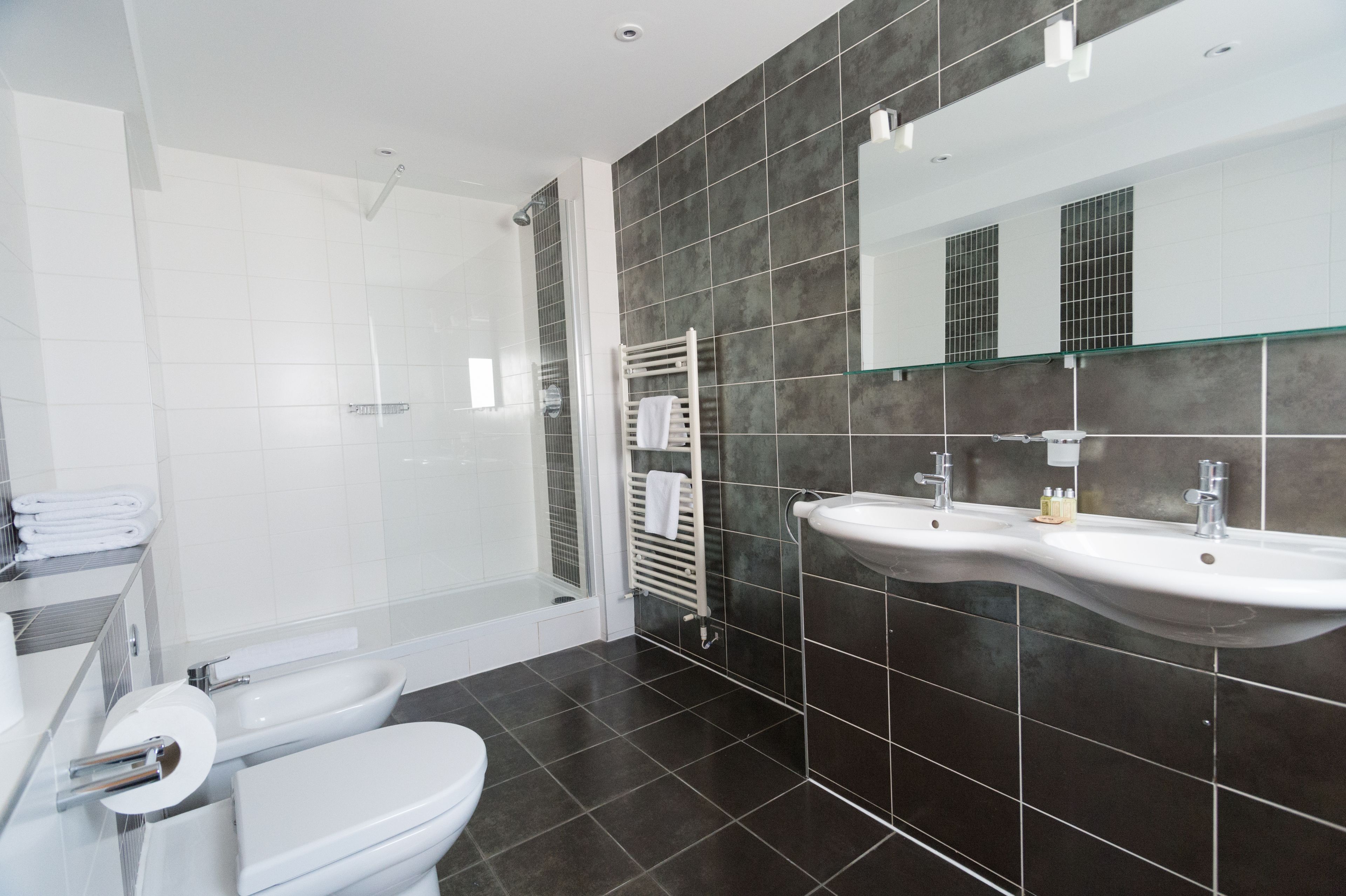 Designer toiletries, hair dryer, towels