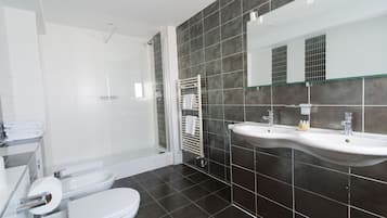 Designer toiletries, hair dryer, towels