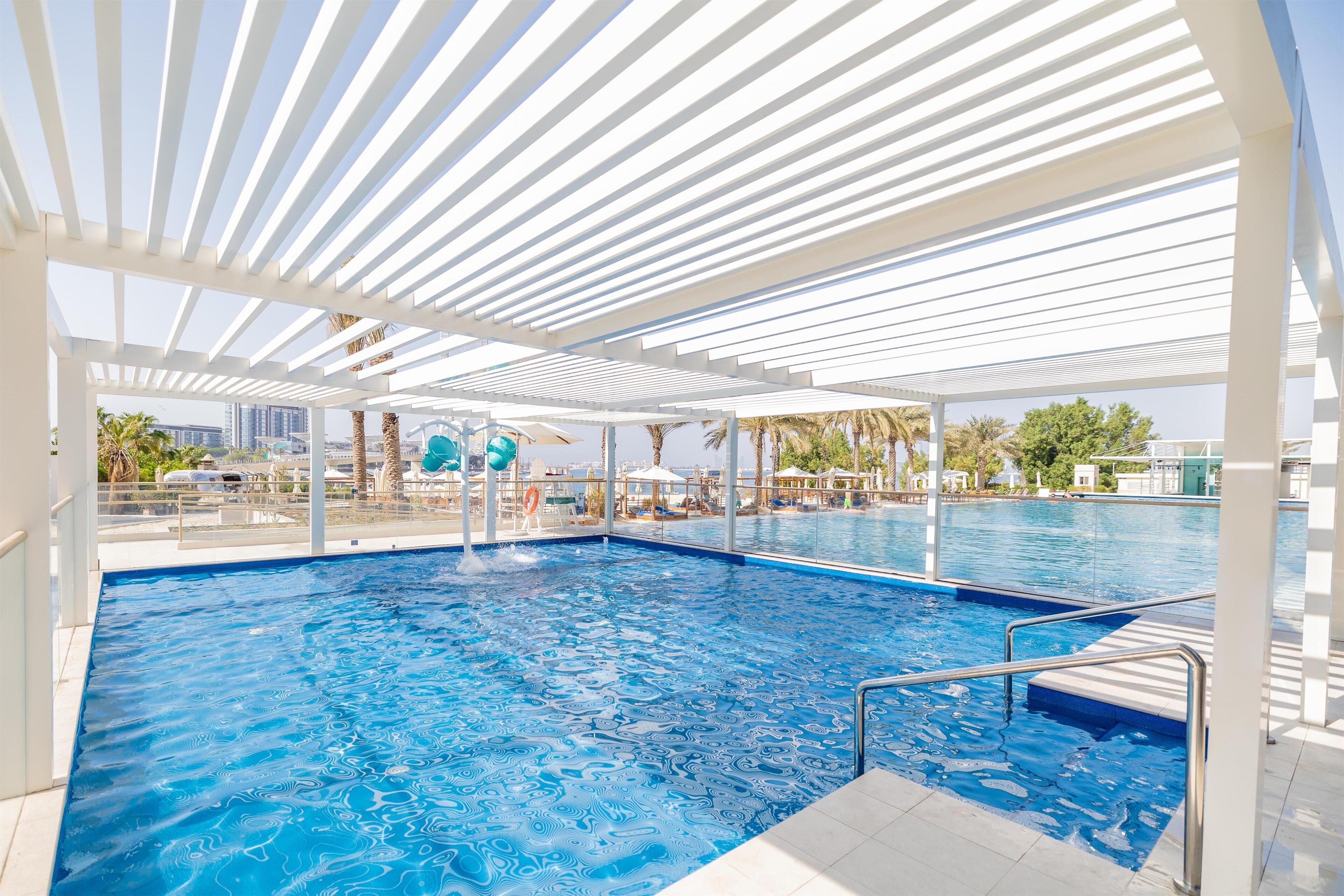 2 outdoor pools, open 9 AM to 9 PM, pool umbrellas, sun loungers