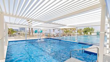 2 outdoor pools, open 9 AM to 9 PM, pool umbrellas, pool loungers