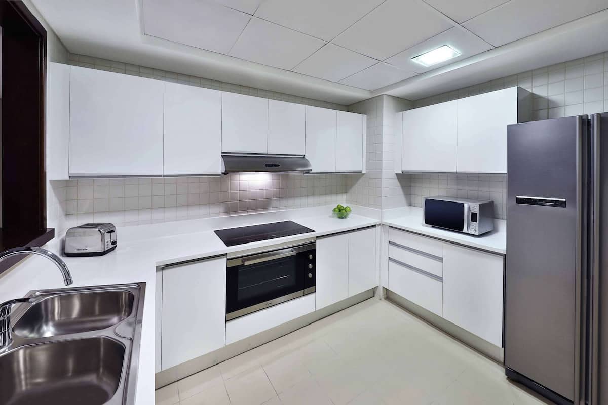 Enjoy cooking in this well-equipped kitchen with an oven, microwave, and sink.