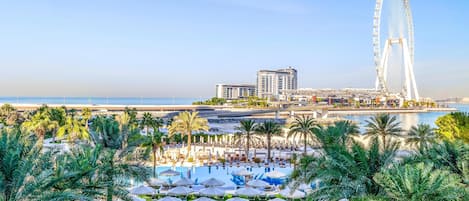 2 outdoor pools, open 9 AM to 9 PM, pool umbrellas, pool loungers