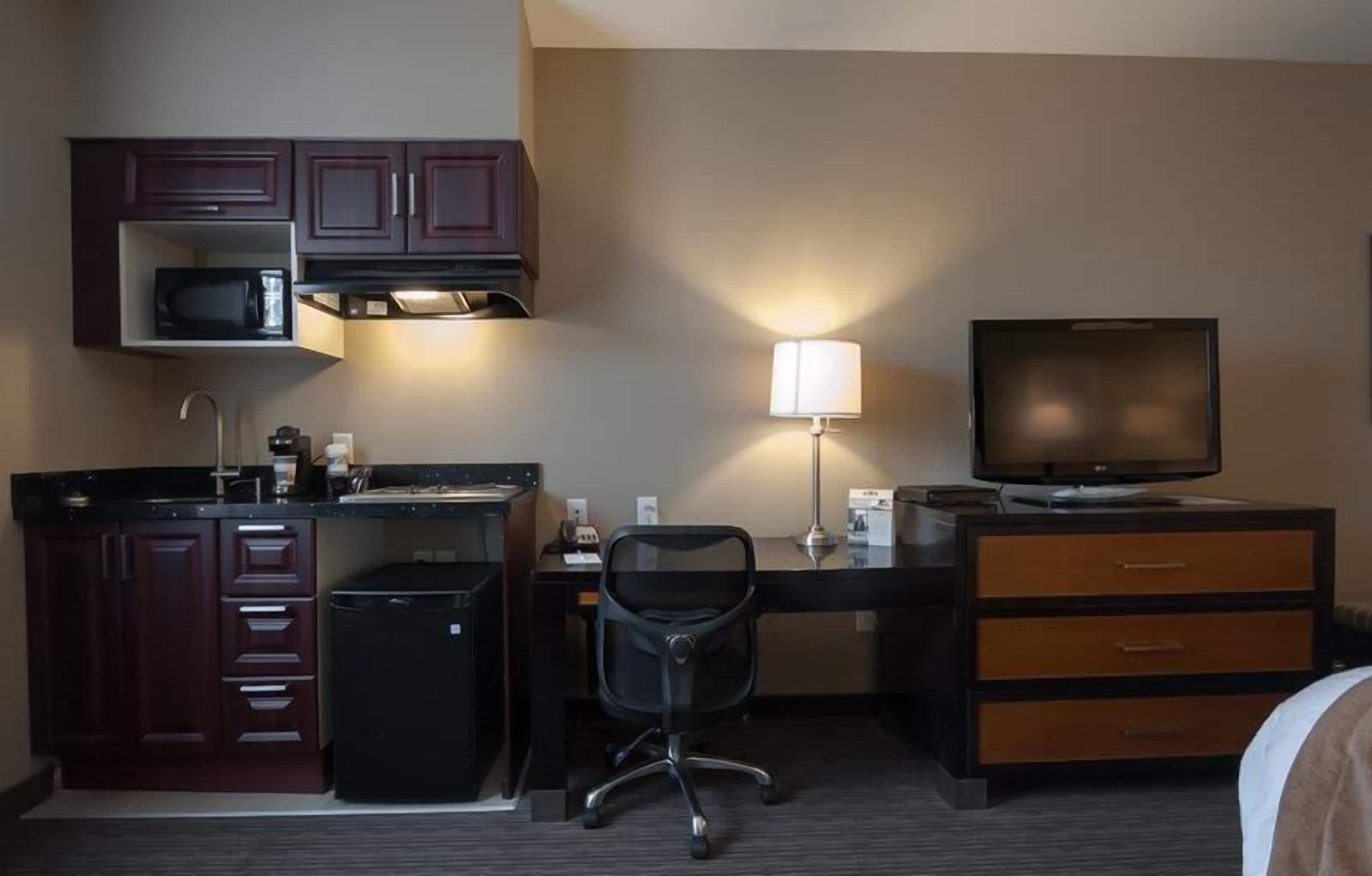 fridge, microwave, coffee/tea maker, cookware/dishes/utensils