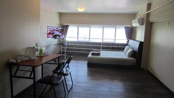 Guest House @ The CEO | Desk, soundproofing, iron/ironing board