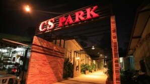 The entrance to a building with a sign that reads "CS PARK". - CS Park (Koh Samui)