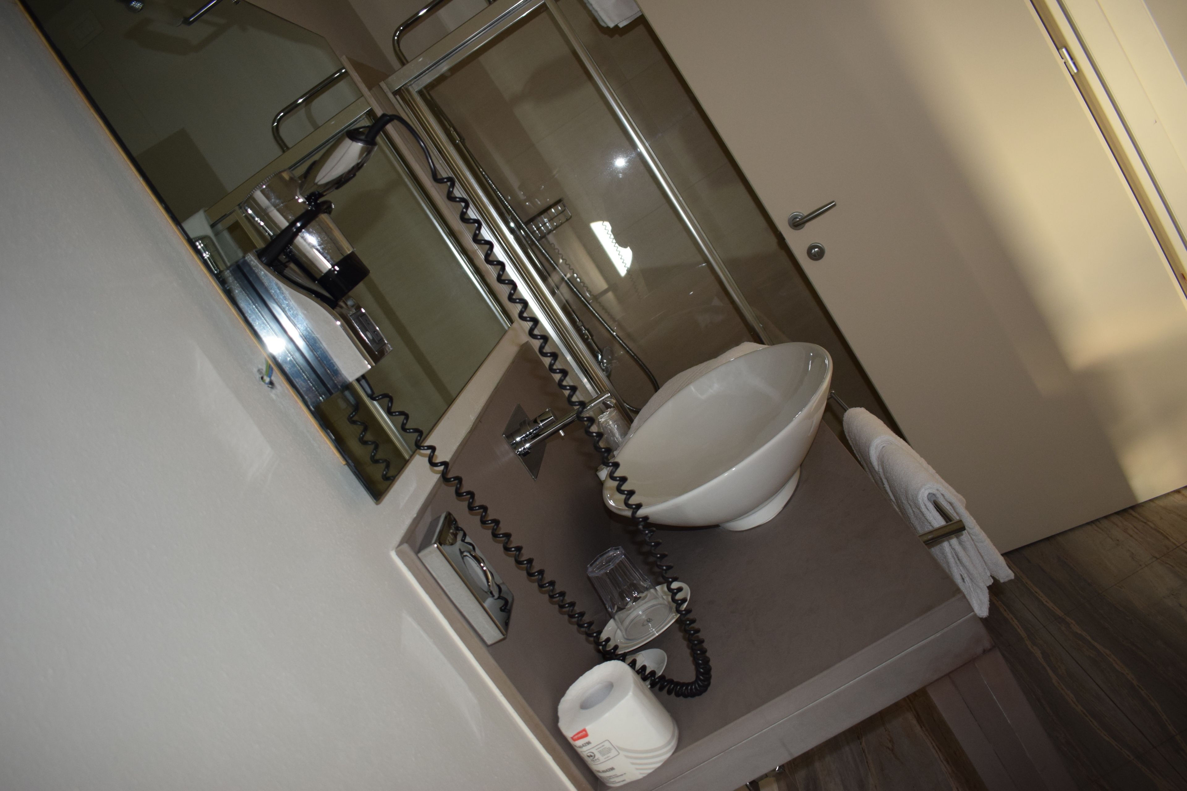 economy room | bathroom | shower, free toiletries, hair dryer, bathrobes