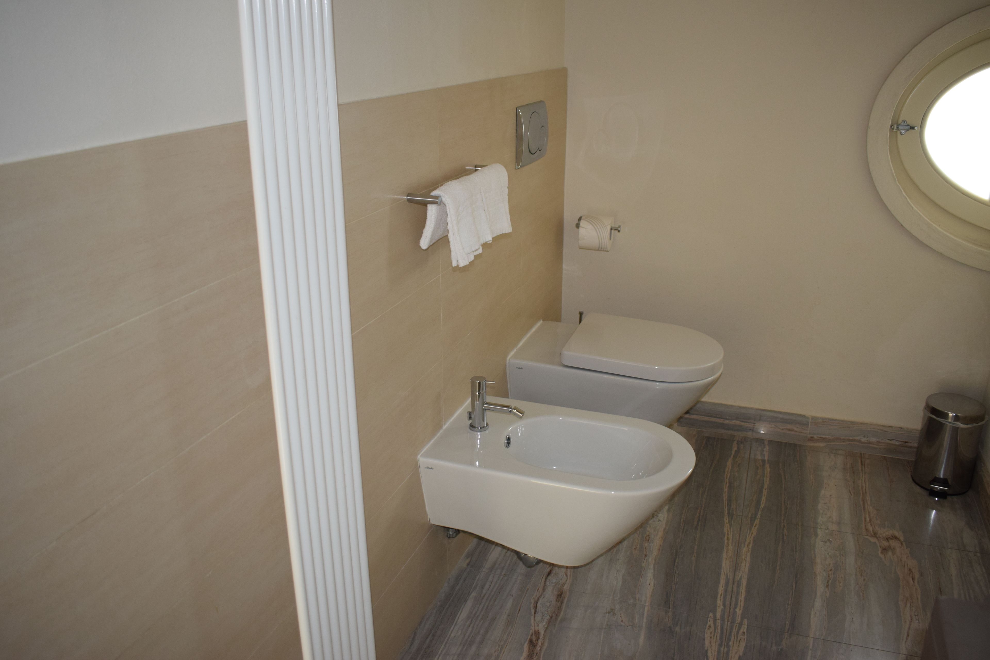 economy room | bathroom | shower, free toiletries, hair dryer, bathrobes