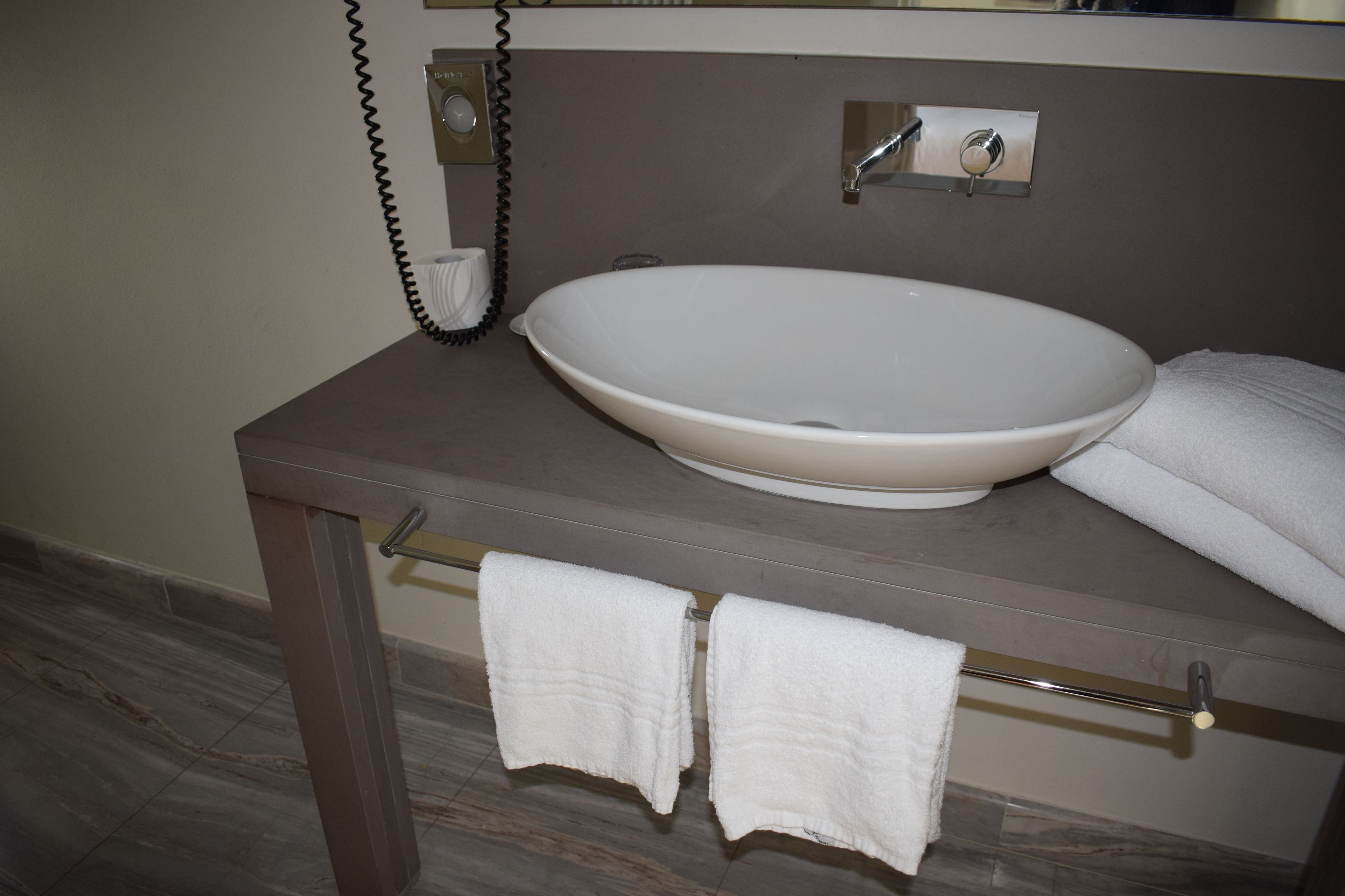 economy room | bathroom | shower, free toiletries, hair dryer, bathrobes