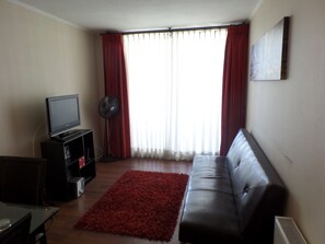 Quadruple Room, 3 Bedrooms | Living room | 32-inch LCD TV with cable channels, TV - Andino Departamentos (Santiago)