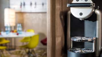A modern coffee machine with a control panel and a two-tiered brewing system.