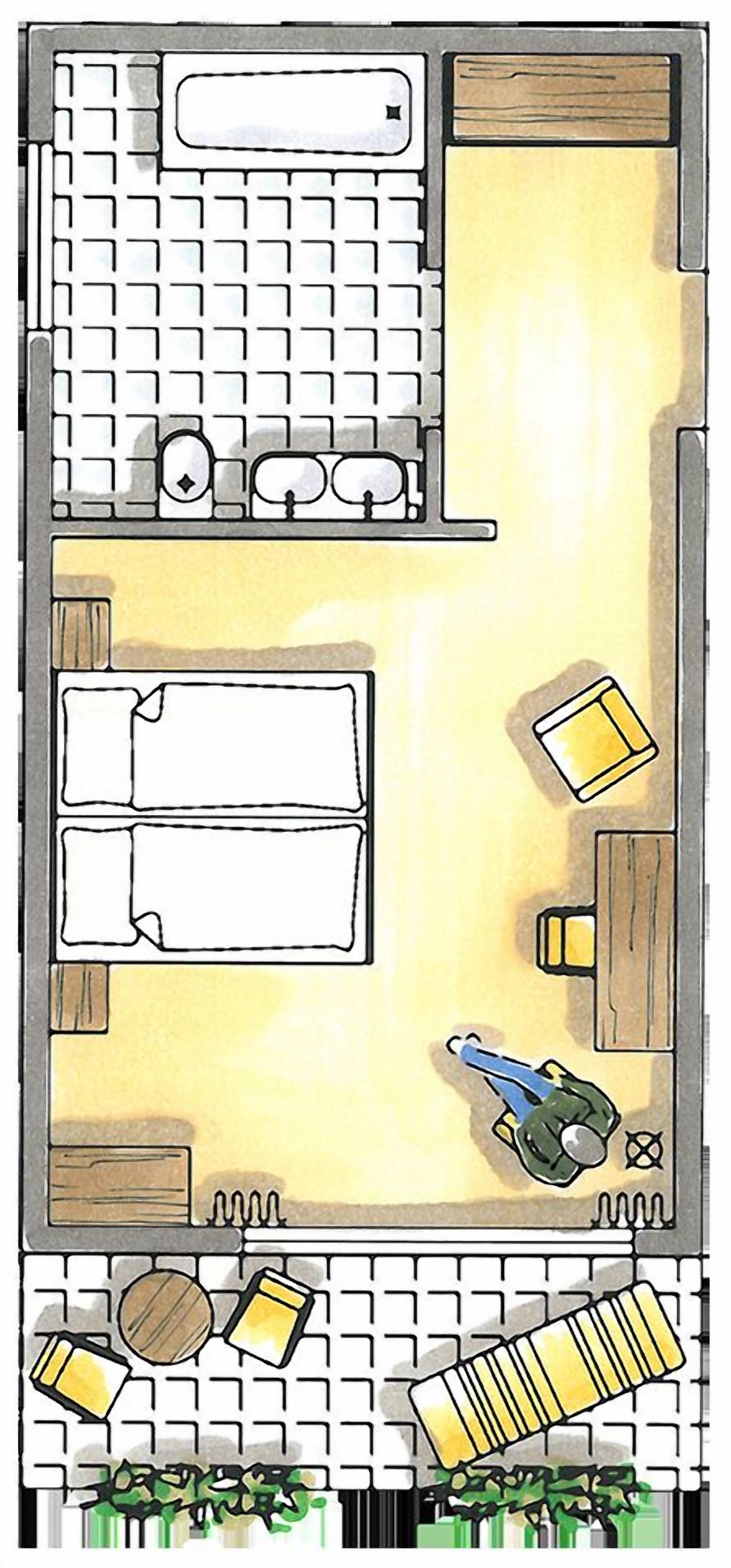 A hotel room layout with a bed, a desk, a chair, a small table, and a plant.