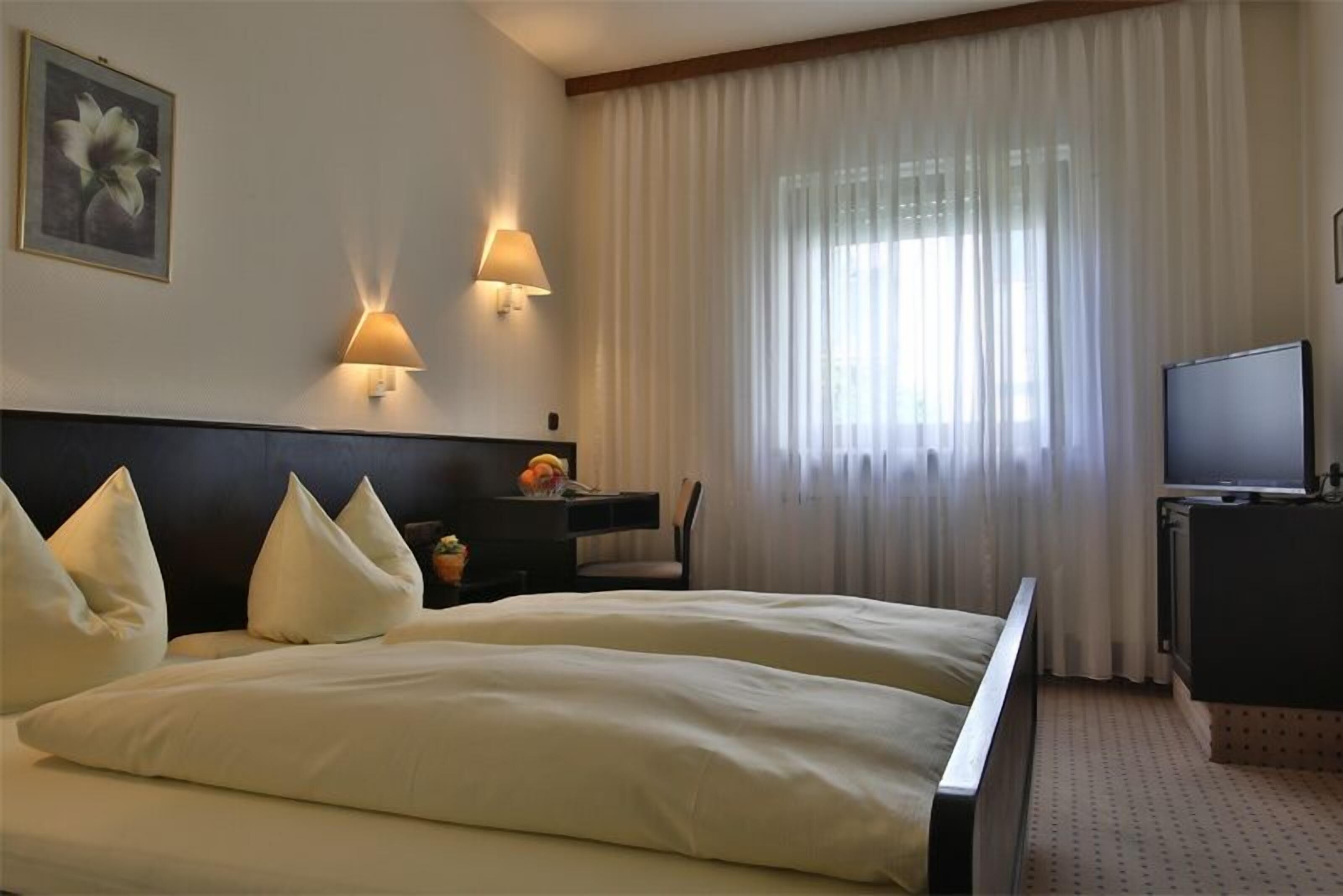 Desk, blackout curtains, free WiFi, bed sheets