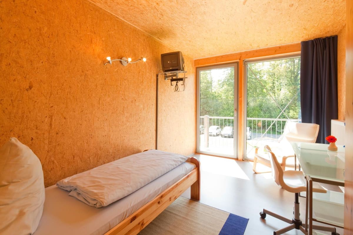 hypo-allergenic bedding, desk, blackout curtains, free cots/infant beds