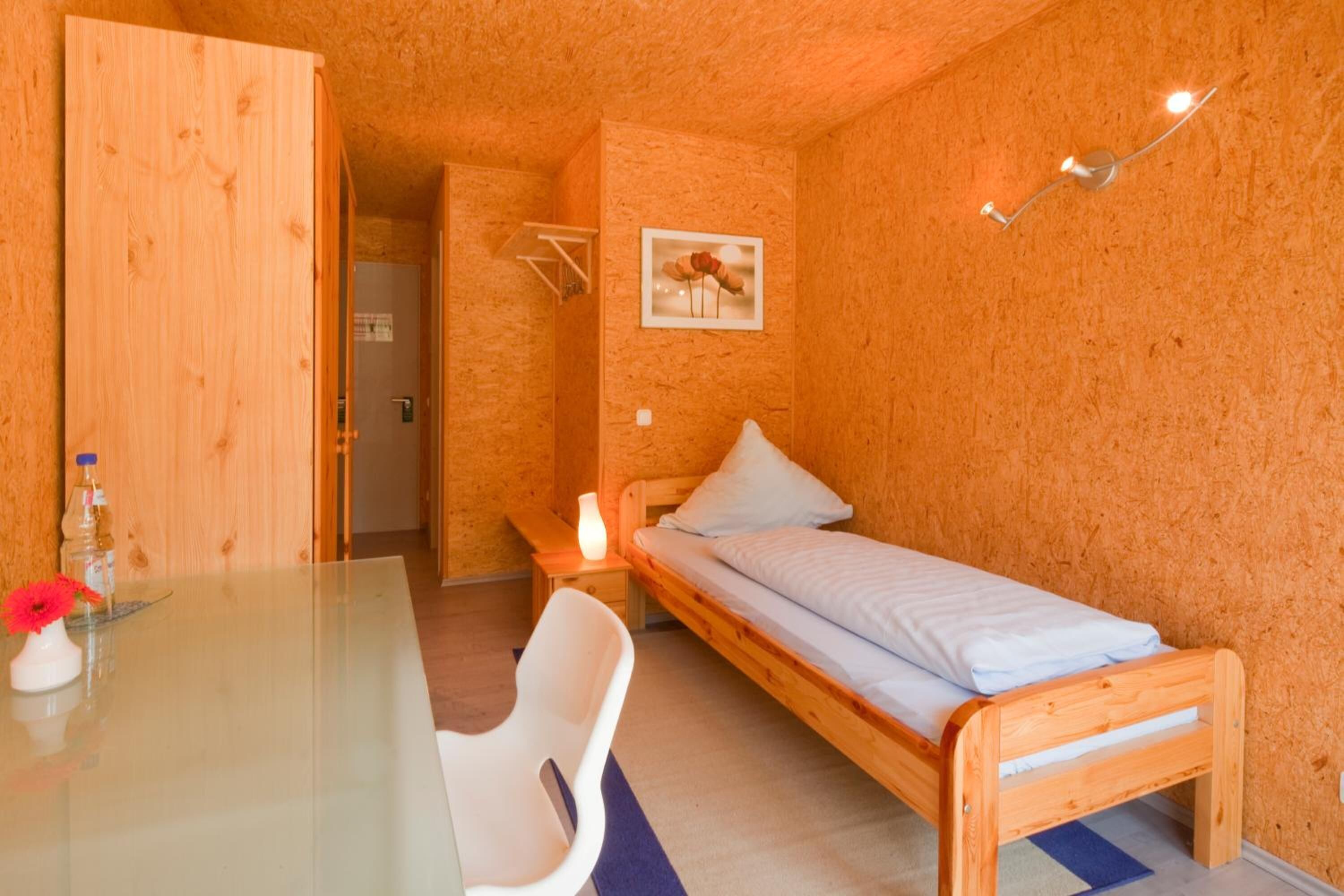 hypo-allergenic bedding, desk, blackout curtains, free cots/infant beds