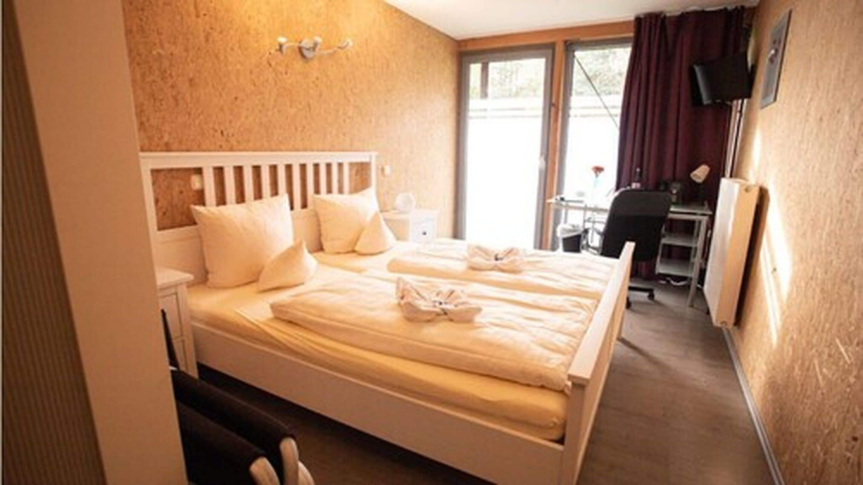 double room | hypo-allergenic bedding, desk, blackout curtains, free cots/infant beds