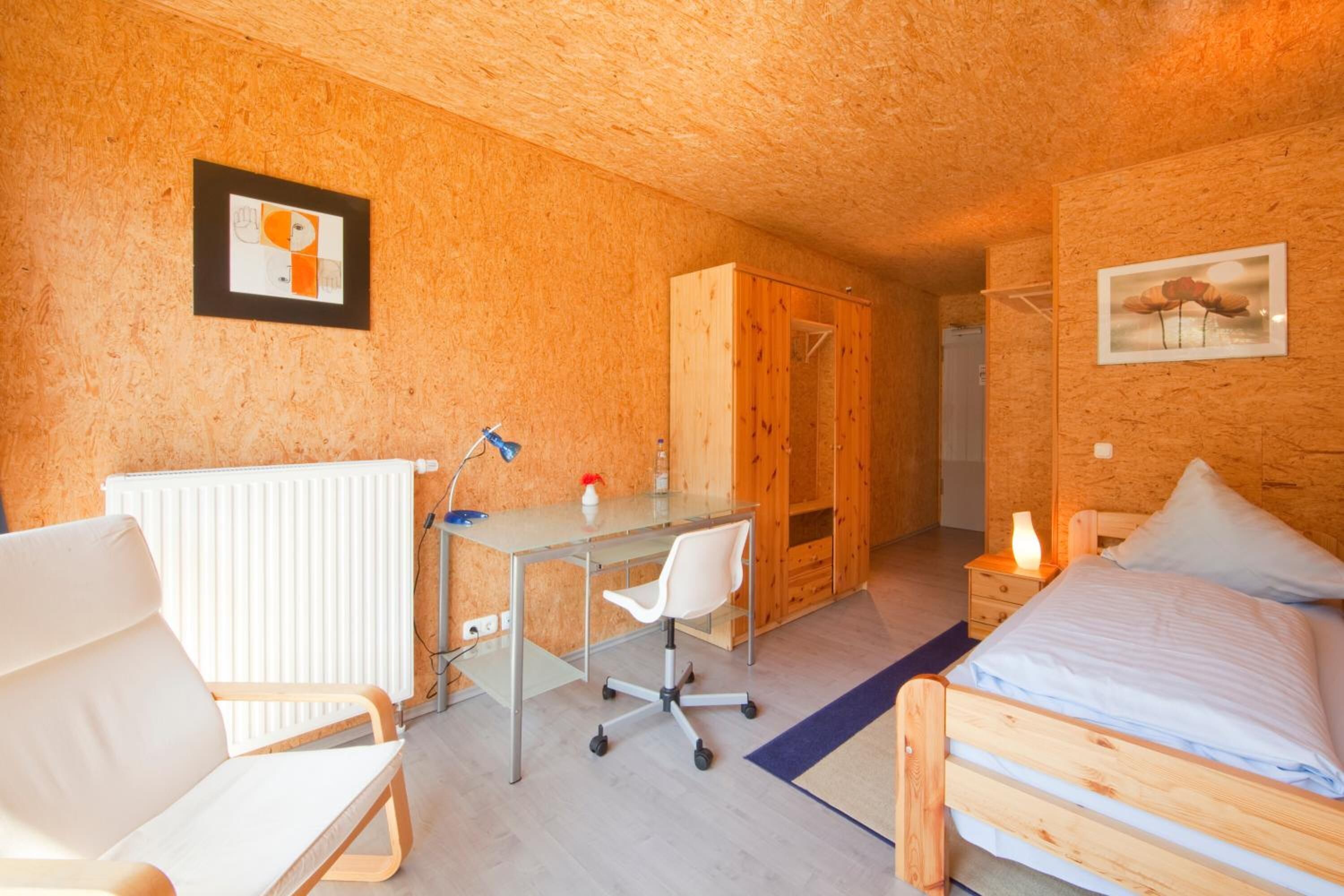 hypo-allergenic bedding, desk, blackout curtains, free cots/infant beds