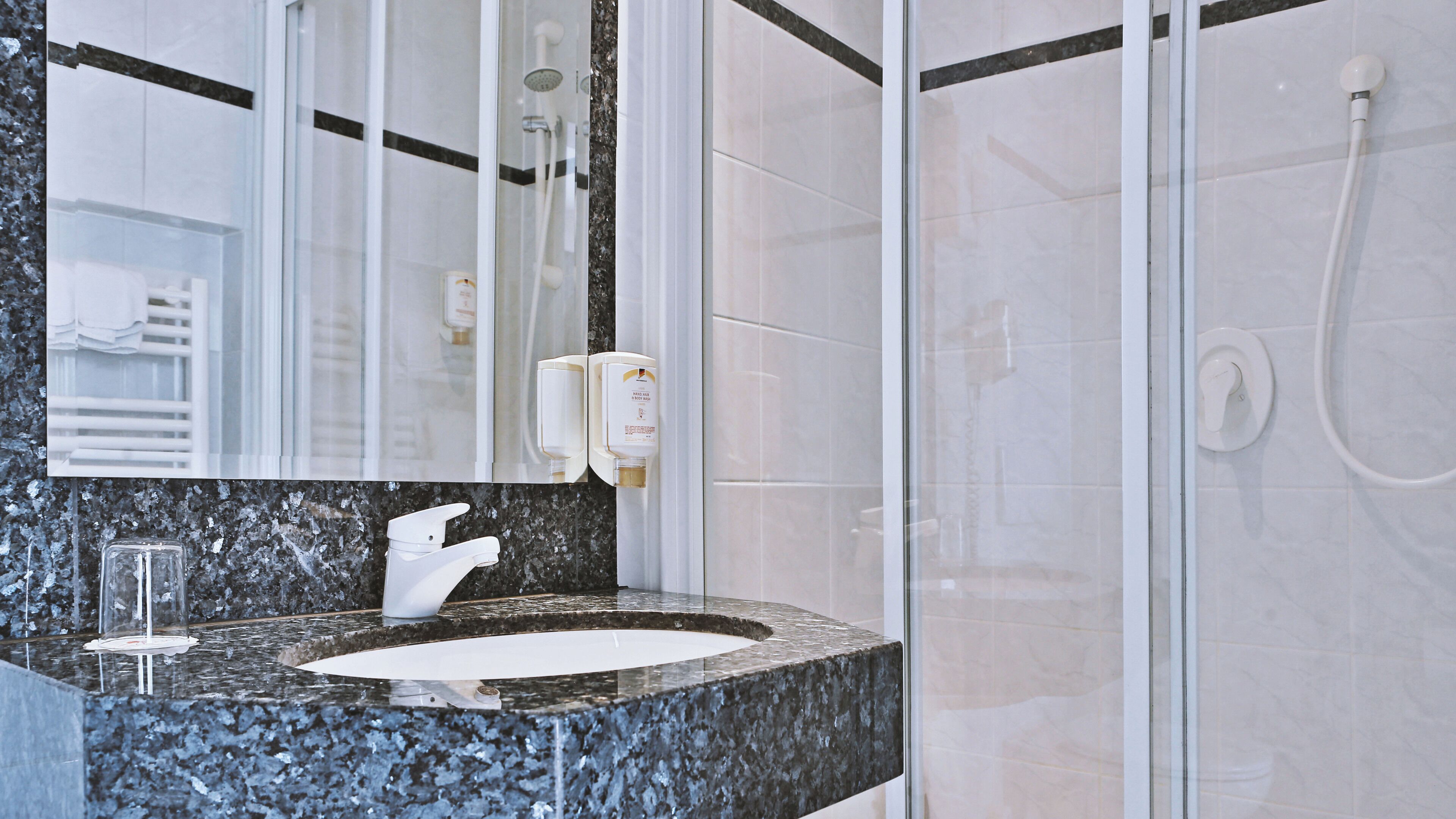 standard single room | bathroom | hair dryer, bathrobes, slippers, towels