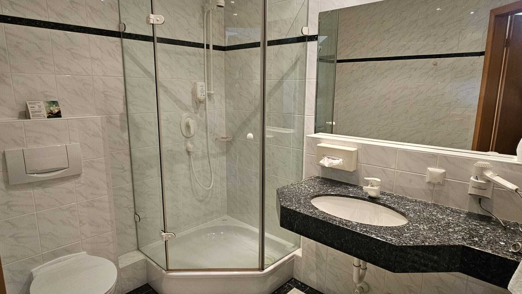 hair dryer, bathrobes, slippers, towels