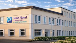 A hotel building with a sign reading 'Sure Hotel Collection by BEST WESTERN.' - Wilhelmshaven Ahoi, Sure Hotel Collection by Best Western (Wilhelmshaven)
