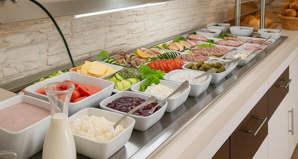A buffet with various food items and condiments.