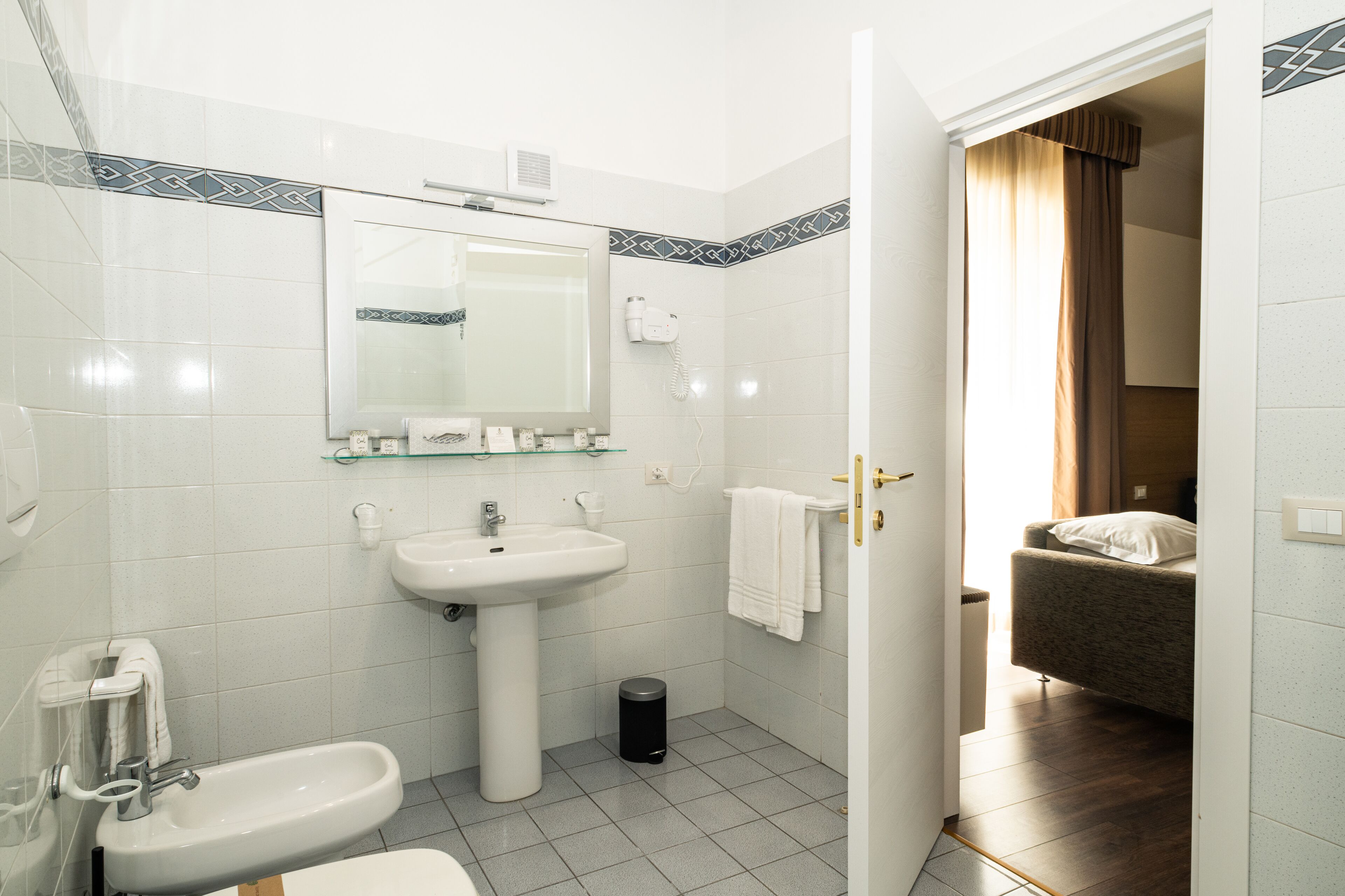 standard double or twin room | bathroom | hair dryer, bidet, towels