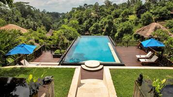 Outdoor pool, open 6 AM to midnight, pool umbrellas, pool loungers