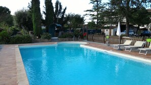 Outdoor pool, pool umbrellas, pool loungers