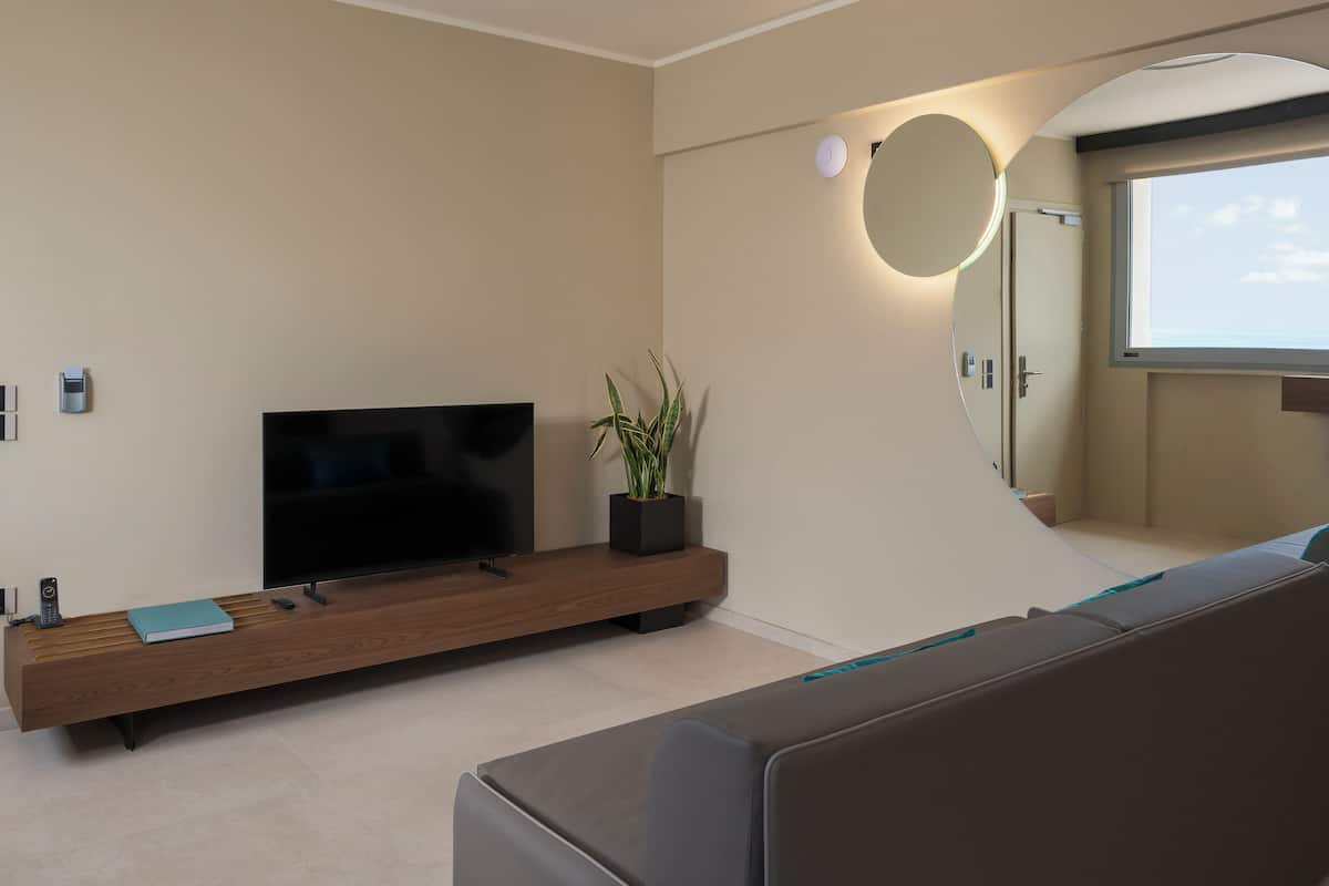 family room, sea view | in-room safe, desk, soundproofing, free wifi