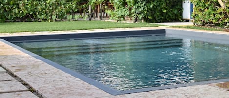 Seasonal outdoor pool, pool loungers